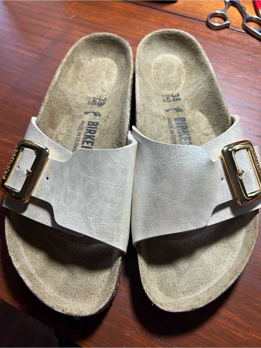 Birkenstock White Single-Strap Slide Sandals with Gold Buckles